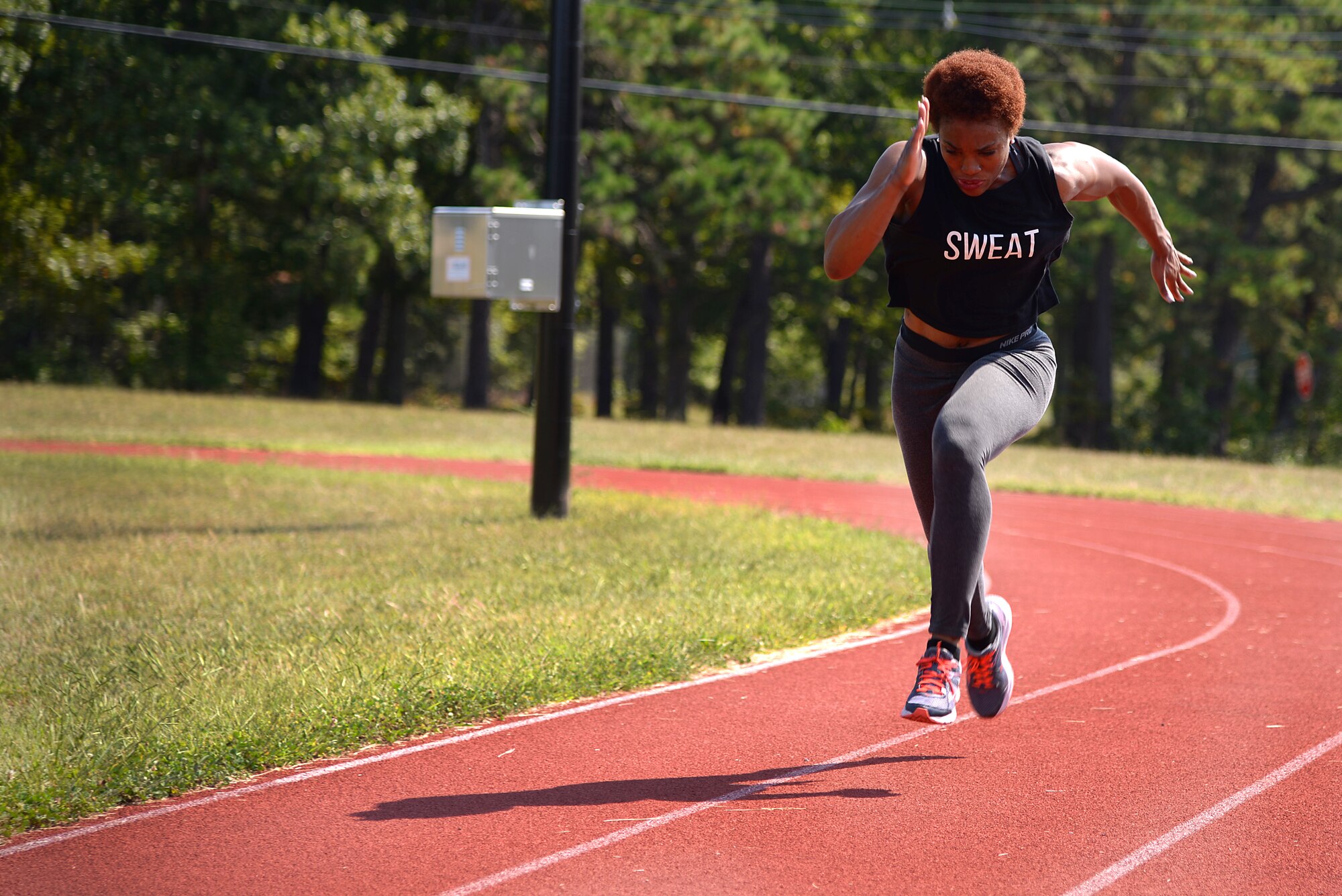 A photo of U.S. Air Force Tech. Sgt. Danielle R. Todman, a services journeyman with the 177th Fighter Wing, running on the base track.