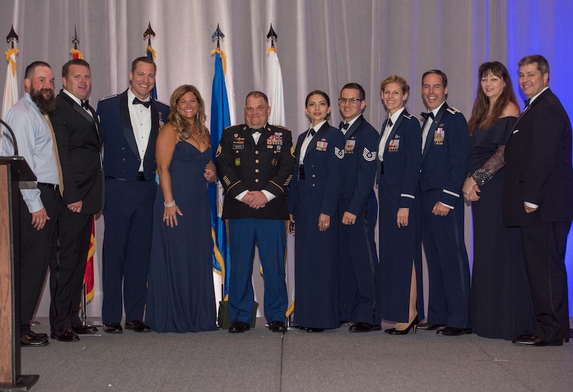 Retired Army Staff Sgt. Dan Powers, a former squad leader with the 118th military police company, stands with members of Joint Base Charleston’s Red 7 and their spouses during the JB Charleston Air Force Ball, Sep. 14, 2019, in Charleston, S.C.