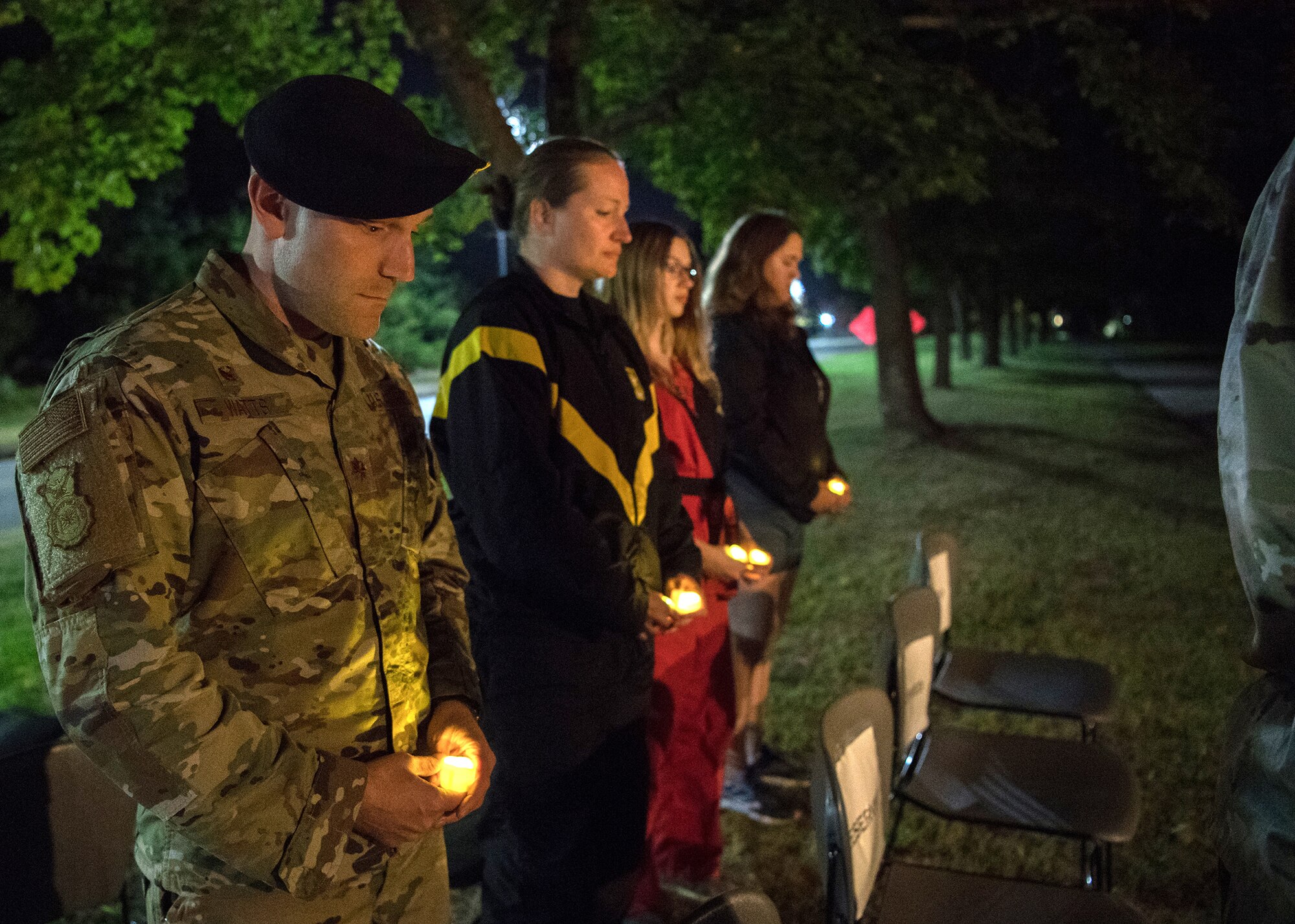 Maj. Shane Watts, 66th Security Forces Squadron commander, holds a candle during the POW/MIA Recognition Day ceremony vigil on Hanscom Air Force Base, Mass., Sept. 12, 2019. National POW/MIA recognition day is nationally observed on the third Friday in September. (U.S. Air Force photo by Jerry Saslav)