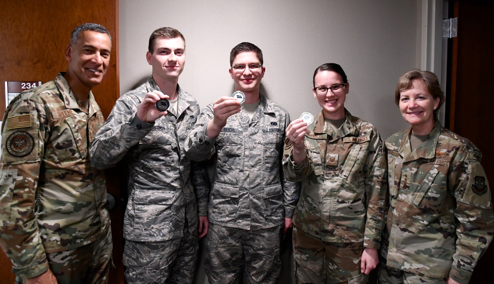 AMC commander presents coins to top performers