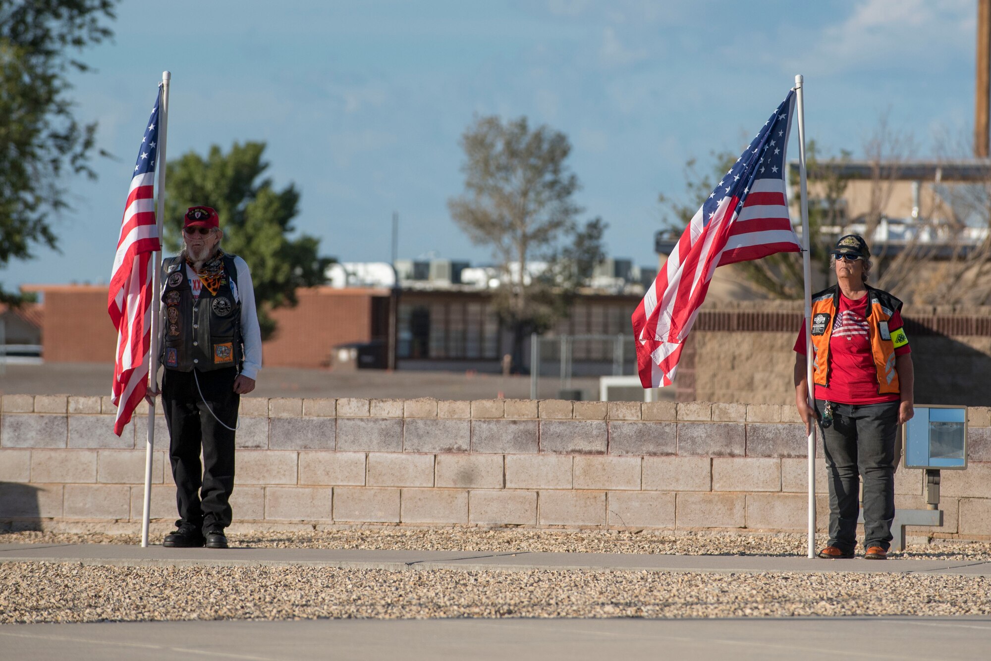 Local Alamogorodo veterans from the Patriot Guard Riders stand with a U.S. flag during a POW/MIA Remembrance Ceremony on Holloman Air Force Base, N.M., Sept. 20, 2019. The Patriot Guard Riders are a motorcycle group whose mission is to attend funeral services of fallen military personnel. (U.S. Air Force photo by Staff Sgt. Christine Groening)