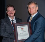 Mike Slater, head of the Signature Measurement Technologies and Systems Division at Naval Surface Warfare Center Carderock Division, left, is presented with the National Defense Industrial Association (NDIA) Award for Technical Achievement in Undersea Warfare by Mike Cortese, division chair for the Undersea Warfare Division Sept. 17 in Groton, Connecticut. (Courtesy photo)