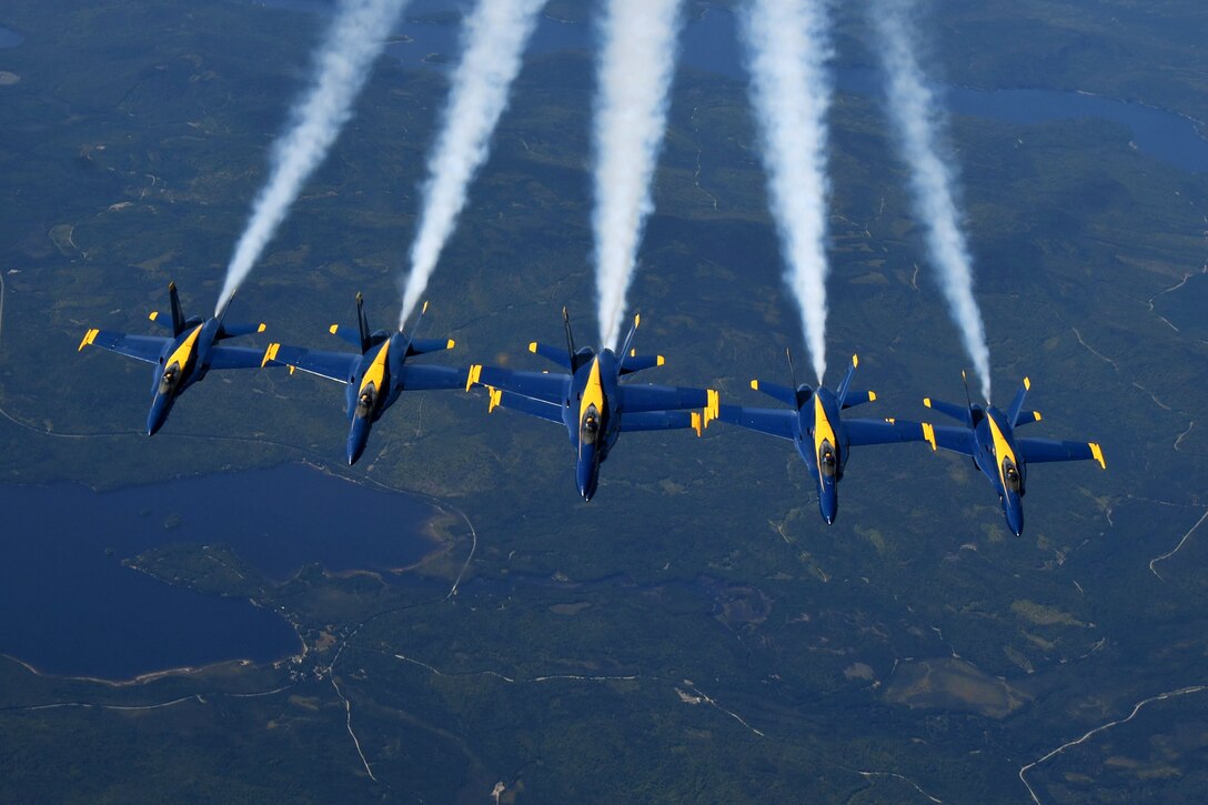 The U.S. Navy Blue Angels depart leaving condensation trails in their place, over Loring Air Force Base, Maine, Aug. 26, 2019. The Blue Angels’ mission is to showcase the pride and professionalism of the Navy and Marine Corps by inspiring a culture of excellence and service to country through flight demonstrations and community outreach. (U.S. Air Force photo by Staff Sgt. Mary McKnight)