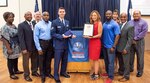 Staff. Sgt. Tyler Repp, 558th Flying Training Squadron basic sensor operator instructor, poses for a photo with members from the Schertz-Cibolo-Selma Chamber of Commerce Military Affairs Committee Sept. 17 at the Schertz Civic Center. Repp was recognized by the Chamber as this month's Hidden Hero and received a letter of recognition and United States flag that was flown over the Texas State Capitol.