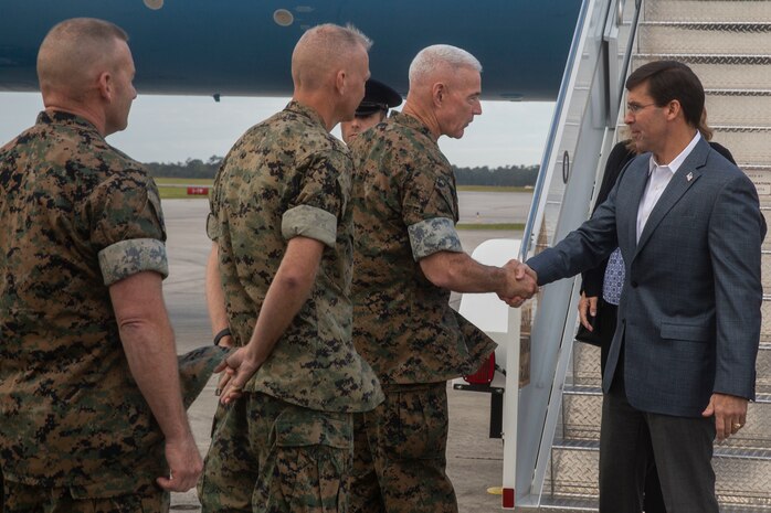 Lieutenant Gen. Brian D. Beaudreault, II Marine Expedtionary Force commanding general, greets Secretary of Defense Dr. Mark Esper as he arrives at Marine Corps Air Station, N.C. Sept. 24 2019. Esper visited major operational commands and toured the base to view residual Hurricane Florence damage. (U.S. Marine Corps photo by Lance Cpl. Nicholas Guevara)