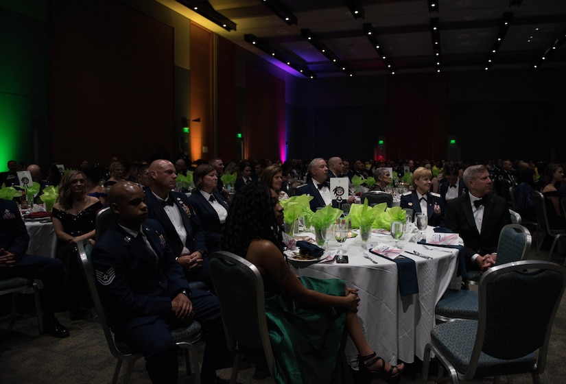 Attendees at the Marvelous 2019 Joint Base Langley-Eustis Air Force Ball listen to a speech by U.S. Air Force General Mike Holmes, the commander of Air Combat Command at the Marvelous 2019 Joint Base Langley-Eustis Air Force Ball at the Hampton Roads Convention Center in Hampton, Virginia, September 21, 2019. Holmes speech compared the traits of Marvel characters to those of Airmen and the U.S. Air Force. (U.S. Air Force photo by Airman 1st Class Sarah Dowe)