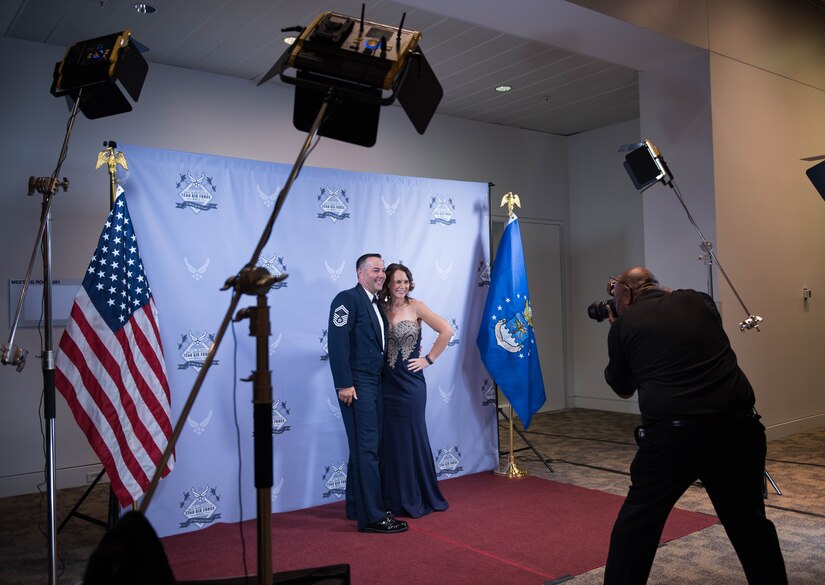 Attendees at the Marvelous 2019 Joint Base Langley-Eustis Air Force Ball have their photo taken at the Hampton Roads Convention Center in Hampton, Virginia, September 21, 2019. Photo stations were scattered throughout the reception area for the ball attendees to capture lasting memories of the 72nd Air Force Birthday. (U.S. Air Force photo by Airman 1st Class Sarah Dowe)