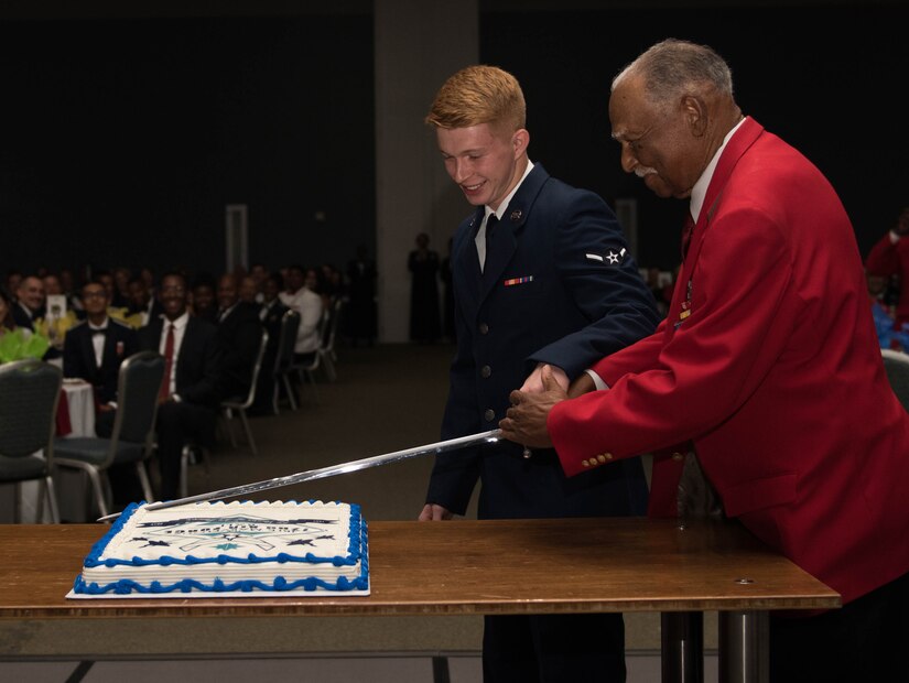 Dr. Harry Quinten, a Tuskegee Airman, and one of the Air Force’s newest Airmen, Nicholas Vanwinkle, cut the birthday cake at the Marvelous 2019 Joint Base Langley-Eustis Air Force Ball at the Hampton Roads Convention Center in Hampton, Virginia, September 21, 2019. The pair were the longest enlisted and the newest enlisted in attendance. (U.S. Air Force photo by Airman 1st Class Sarah Dowe)