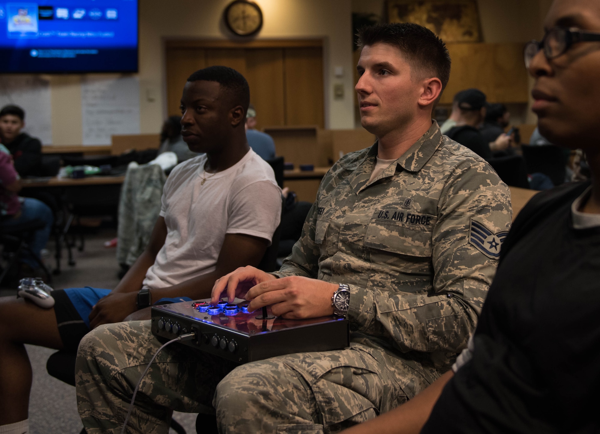 U.S. Air Force Staff Sgt. Sebastian Godsey, 633rd Medical Group family health clinic aerospace medical technician, plays video games with Airmen at Joint Base Langley-Eustis, Virginia, September 18, 2019. Godsey started a video gaming club to help foster connectedness across the base. (U.S. Air Force photo by Airman 1st Class Sarah Dowe)