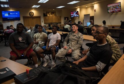 Game night attendees at the Bateman Library compete in a tournament at Joint Base Langley-Eustis, Virginia, September 18, 2019. The gaming club also competes with organizations in the community that support local charities. (U.S. Air Force photo by Airman 1st Class Sarah Dowe)