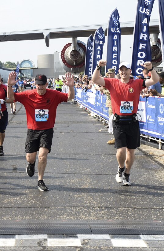 Air Force Chief of Staff Gen. David L. Goldfein crosses the finish line Saturday, Sept. 21, 2019 at the Air Force Half Marathon at Wright-Patterson AFB in Ohio. Goldfein ran the race to promote the importance of physical fitness for the Air Force. Like many other runners, Goldfein was also  running to honor specific airmen, in this case, Staff Sgt. Dylan Elchin a Special Tactics combat controller who was killed in Afghanistan in 2018. Goldfein wore a wristband with Elchin’s name and a t-shirt from the Special Tactic memorial march held earlier this year. (U.S. Air Force photo by Wesley Farnsworth)