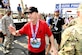 Air Force Chief of Staff Gen. David L. Goldfein acknowledges congratulations after finishing the Air Force Half Marathon Sept. 21, 2019 at Wright-Patterson AFB, Ohio. Goldfein’s shirt honored the Special Tactics Memorial March earlier this year that paid tribute to Staff Sgt. Dylan Elchin a Special Tactics combat controller who was killed in Afghanistan in 2018. His hat carried a SERE instructor logo that was given to him during a visit to Fairchild AFB. (U.S. Air Force photo by Scott Ash)