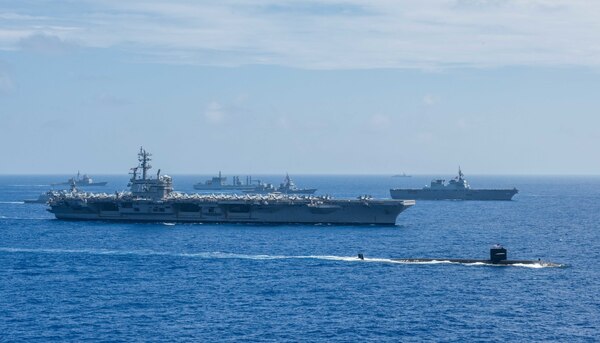 PHILIPPINE SEA (June 15, 2018) Ships from the Indian Navy, Japan Maritime Self-Defense Force (JMSDF) and the U.S. Navy sail in formation during Malabar 2018. Malabar 2018 is the 22nd rendition of the exercise and the first time it has been hosted off the coast of Guam. Malabar is designed to advance military-to-military coordination in a multinational environment between the U.S., Japan and Indian maritime forces.