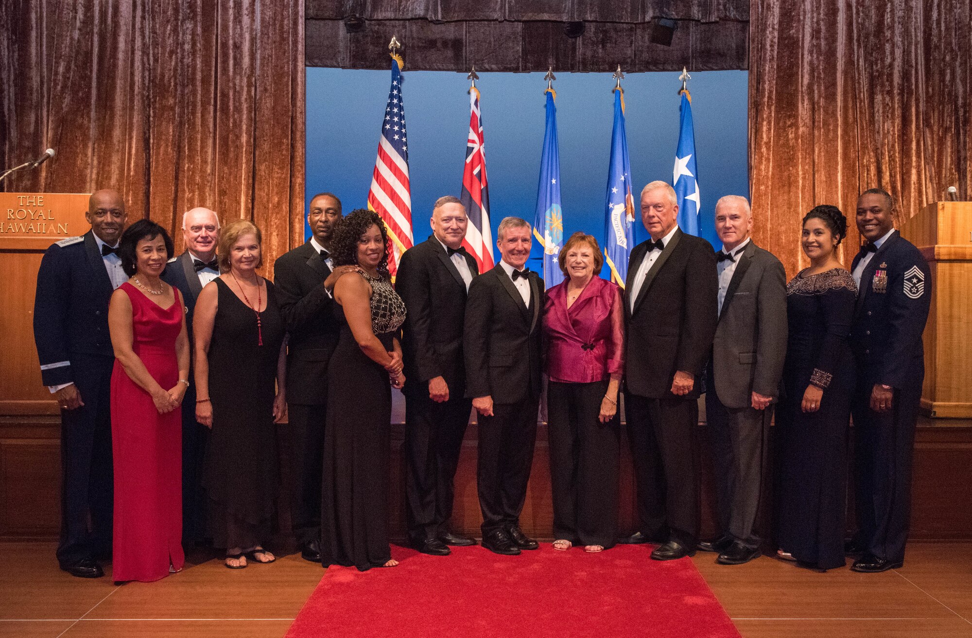 Gen. CQ Brown, Jr., Pacific Air Forces commander, and Chief Master Sgt. Anthony Johnson, PACAF command chief, take a group photo with their spouses and six former PACAF commanders and command chiefs and their spouses during the Air Force Ball official ceremony, Honolulu, Hawaii, Sept. 20, 2019. This year, the United States Air Force celebrated its 72nd birthday and Pacific Air Forces celebrated its 75th anniversary. As part of the birthday and anniversary celebrations, six former PACAF commanders and command chiefs visited Hawaii and were guests of honor. (U.S. Air Force photo by Staff Sgt. Hailey Haux)