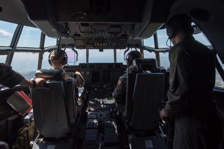 Aircrew of a C-130J Super Hercules assigned to the 36th Airlift Squadron and Joey DeGrella, Pilot for a Day program participant, fly over the Chubu region, Japan, Sept. 20, 2019.