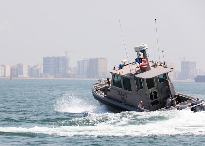 Sailors assigned to Task Force Shore Battle Space pursue a Bahraini Coast Guard security boat during exercise Neon Defender 19. Exercise Neon Defender 19 is a bilateral surface and maritime security exercise between the U.S. Navy and Bahrain Defense Force to enhance interoperability and war fighting readiness, fortify military- to- military relationships between the United States and the Kingdom of Bahrain, advance mutual operational capabilities and strengthen civil-to-military relationships.