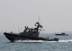 A U.S. Navy harbor security boat patrols the harbor of Naval Support Activity Bahrain during exercise Neon Defender 19. Exercise Neon Defender 19 is a bilateral surface and maritime security exercise between the U.S. Navy and Bahrain Defense Force to enhance interoperability and war fighting readiness, fortify military- to- military relationships between the United States and the Kingdom of Bahrain, advance mutual operational capabilities and strengthen civil-to-military relationships.