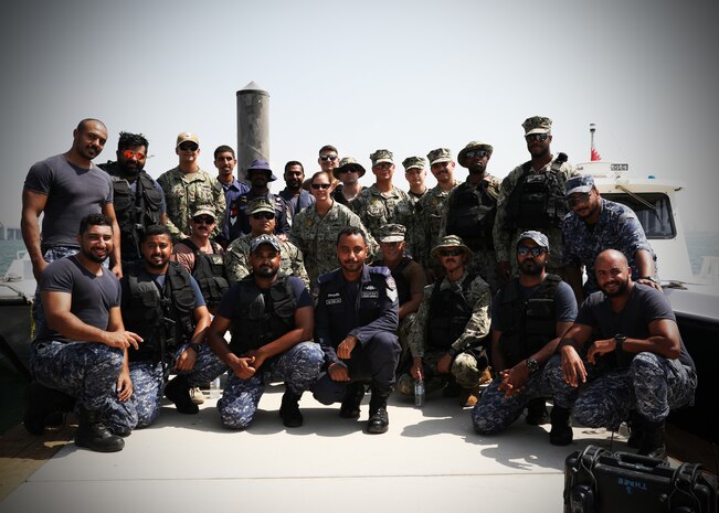 U.S. Navy Sailors assigned to Task Force Shore Battle Space and members of the Bahraini Coast Guard pose for a photo after training during exercise Neon Defender 19. Exercise Neon Defender 19 is a bilateral surface and maritime security exercise between the U.S. Navy and Bahrain Defense Force to enhance interoperability and war fighting readiness, fortify military- to- military relationships between the United States and the Kingdom of Bahrain, advance mutual operational capabilities and strengthen civil-to-military relationships.
