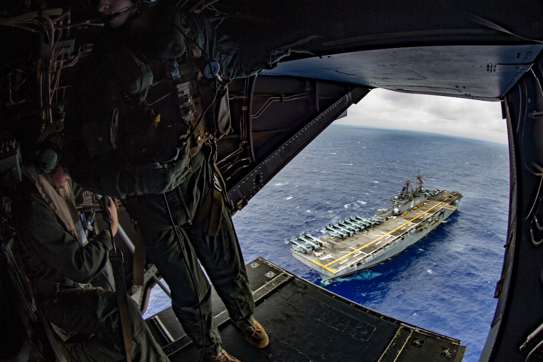 Marines fly over USS Boxer.