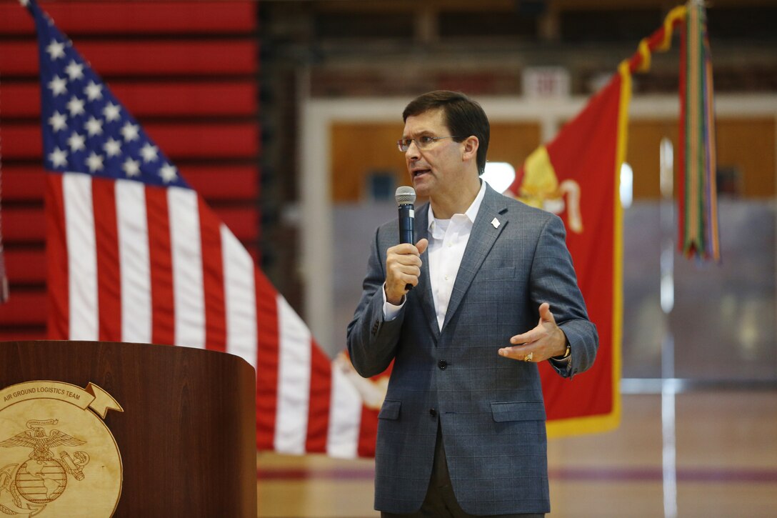 Defense Secretary Dr. Mark T. Esper speaks to service members during a town hall.