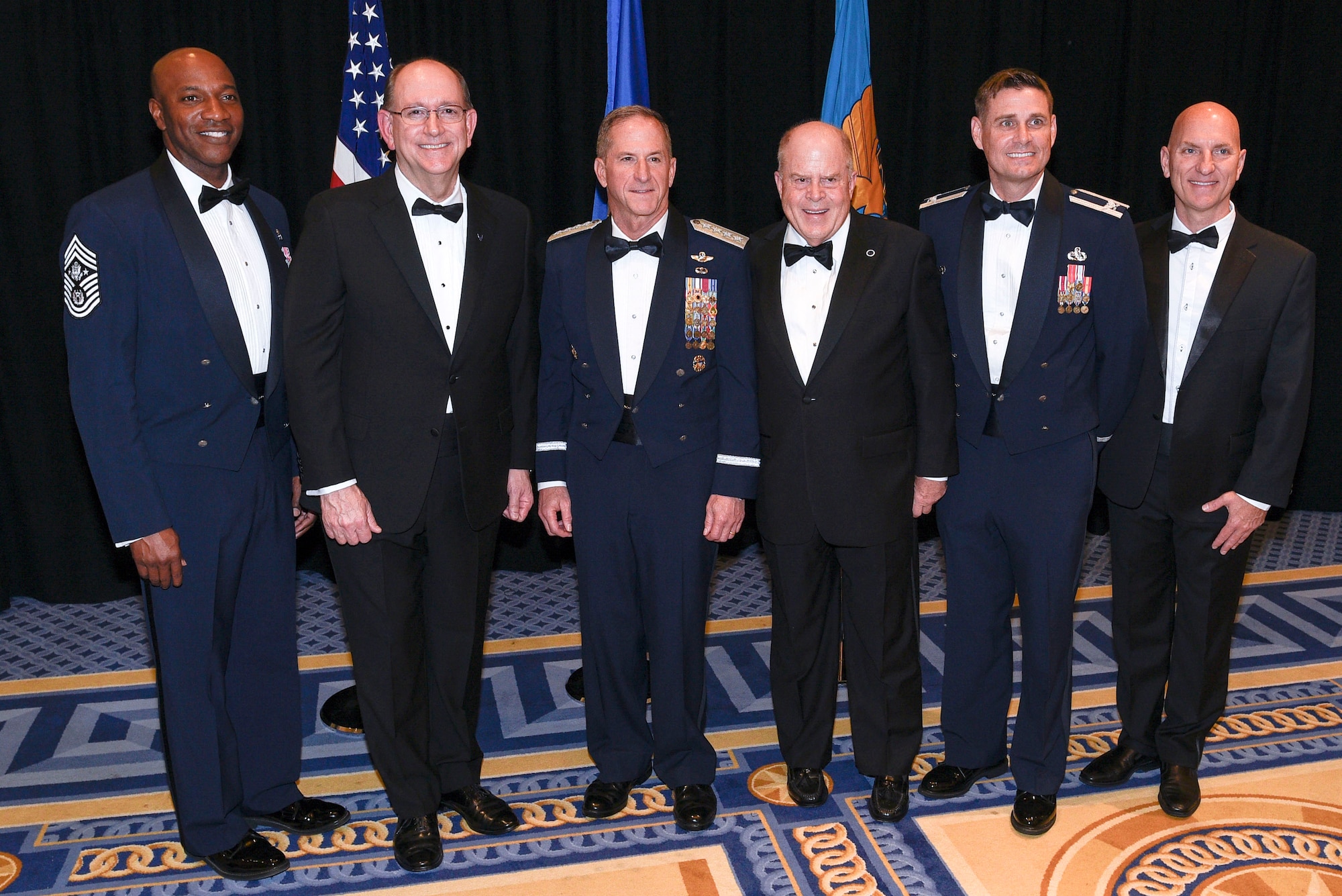 Chief Master Sergeant of the Air Force Kaleth O. Wright, Acting Secretary of the Air Force Matthew P. Donovan, Chief of Staff of the Air Force Gen. David L. Goldfein, Air Force Association Chairman of the Board F. Whitten Peters, Col. Stephen Sanders, Air Force JROTC director, and Todd Taylor, Air Force JROTC chief of program development, pose before the Air Force Birthday Dinner in National Harbor, Maryland, Sept. 18, 2019. Peters presented Air Force JROTC with the AFA Chairman’s Award for Aerospace Education Achievement to recognize the work of 120,000 cadets, more than 1,900 instructors and headquarters staff on promoting and advocating aerospace education and science, technology, engineering and math programs.