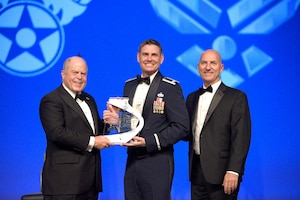 F. Whitten Peters, Air Force Association chairman of the board, presents the AFA Chairman’s Award for Aerospace Education Achievement to Col. Stephen Sanders, Air Force JROTC director, and Todd Taylor, Air Force JROTC chief of program development, during the Air Force Birthday Dinner in National Harbor, Maryland, Sept. 18, 2019. Air Force JROTC earned the award for its commitment and advocacy for aerospace education and science, technology, engineering and math programs.