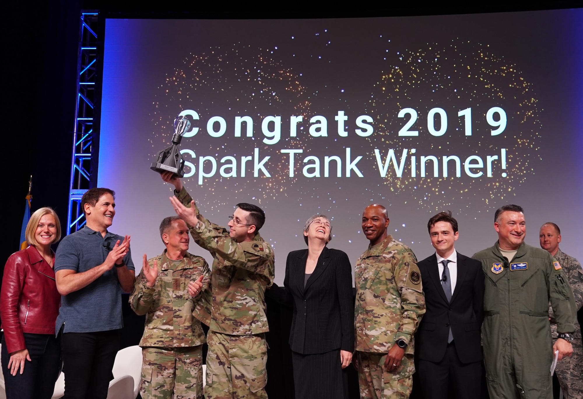 The 2019 Air Force Spark Tank competition judges congratulate Master Sgt. Jonathan Maas