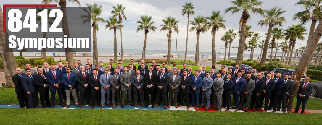 Career Recruiters with the 8th Marine Corps District pose for a group photo during the 8412 Symposium at the Hotel Galvez and Spa in Galveston, Texas, Aug. 28, 2019. The 8412 Symposium provides a forum for Career Recruiters across the 8th Marine Corps District to collaborate, review recruiting doctrine, and discuss ways to support Marine Corps recruiters.