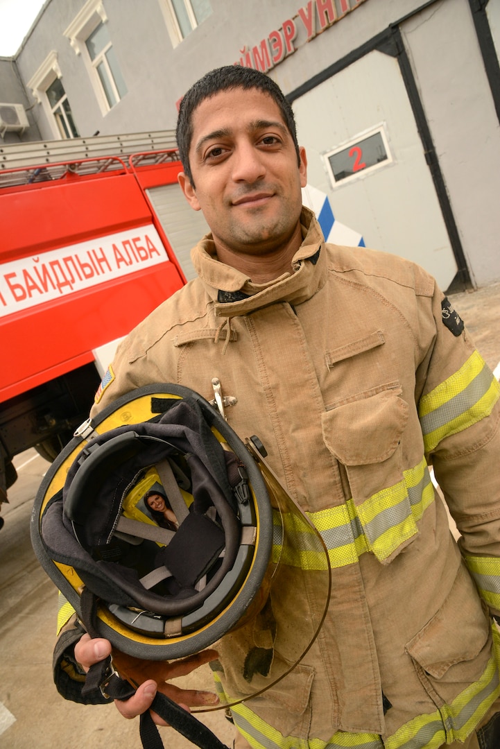 Cheyenne Sanchez, a firefighter and emergency medical technician from Juneau, Alaska, displays the inside of his helmet with a photograph of his sister, Sept. 11, 2019, in Sainshand, Mongolia. The photo is a reminder to Sanchez that he always has a reason to return home safe whenever he is called into harms way. Gobi Wolf 19 is hosted by the Mongolian National Emergency Management Agency and Mongolian Armed Forces as part of the U.S. Army Pacific's humanitarian assistance and disaster relief "Pacific Resilience" series.