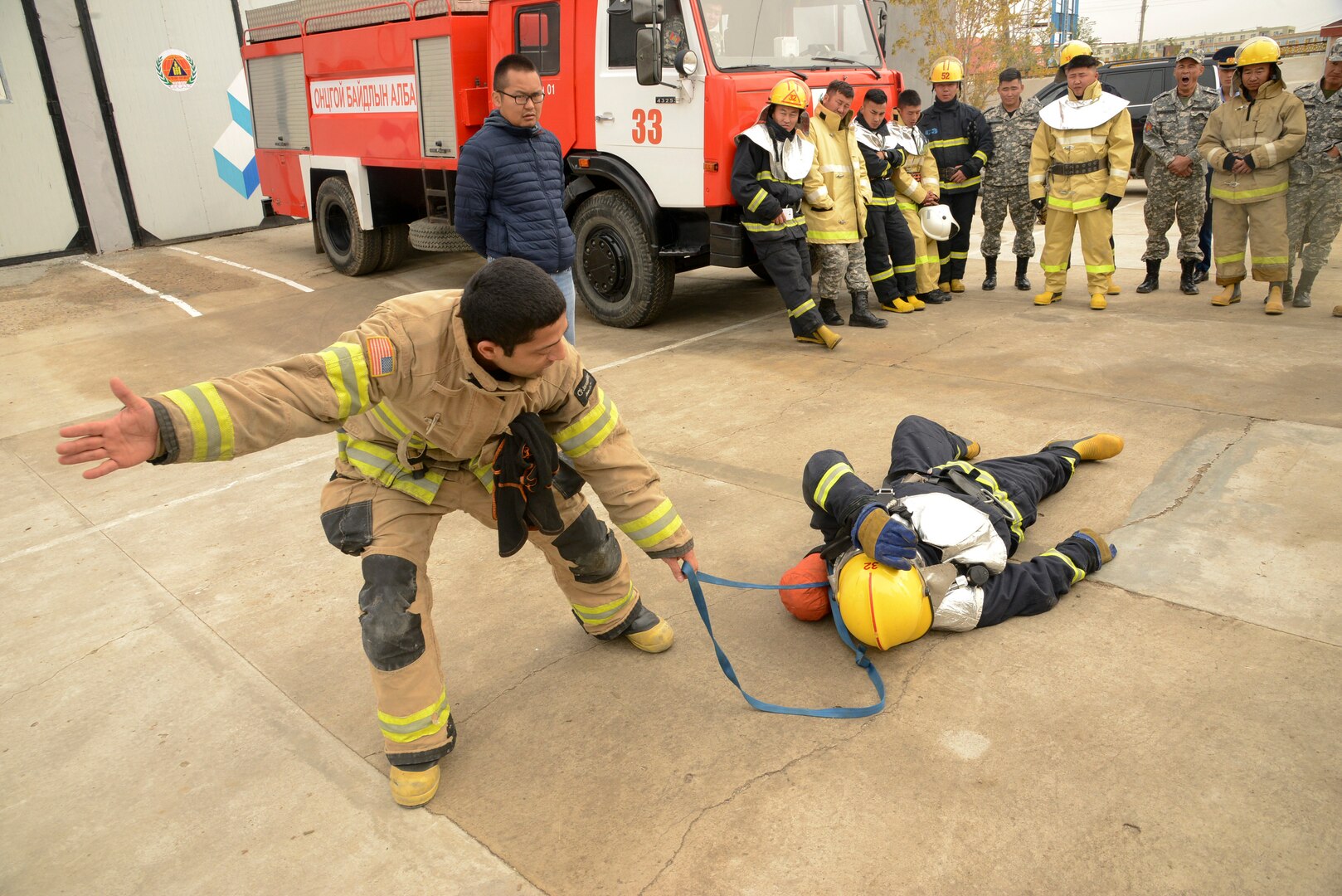 Cheyenne Sanchez, a firefighter and emergency medical technician from Juneau, Alaska, leads members of the National Emergency Management Agency (NEMA) through a series of training situations during the Gobi Wolf 19 Exercise, Sept. 11, 2019 in Sainshand, Mongolia. GW 19 is hosted by the Mongolian National Emergency Management Agency and Mongolian Armed Forces as part of the U.S. Army Pacific's humanitarian assistance and disaster relief "Pacific Resilience" series.