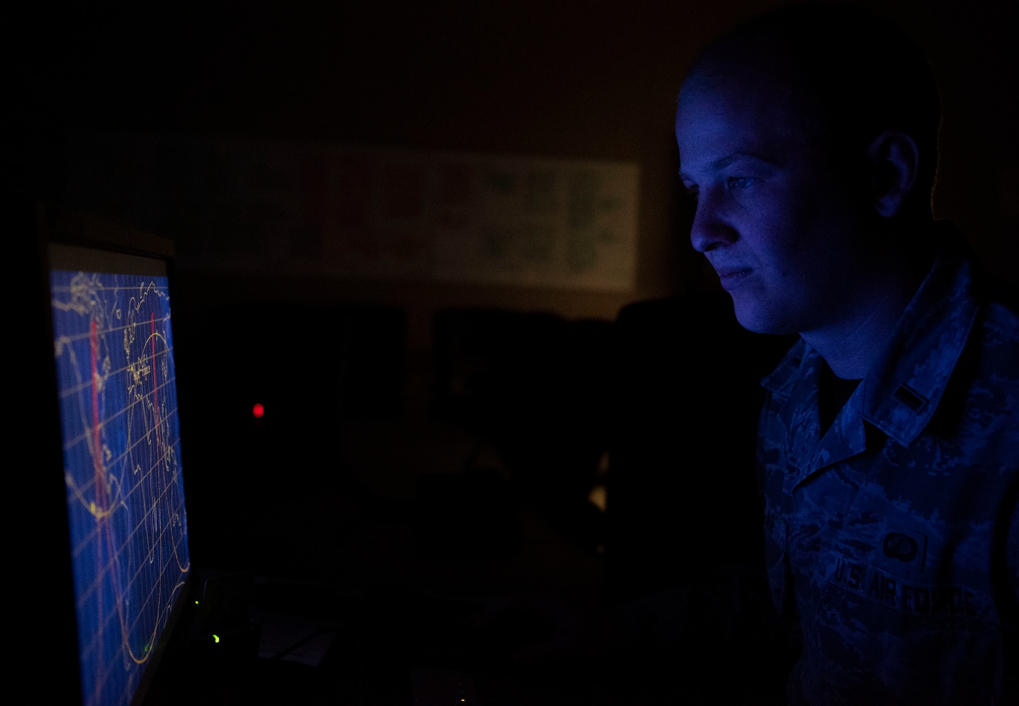 First Lt. Scott Podlogar, 4th Space Operations Squadron Enhanced Polar System contracting officer representative, observes an illustration of the Molniya orbit at Schriever Air Force Base, Colorado, Sept. 20, 2019. The Molniya orbit is a highly inclined orbit that enables satellites to provide better coverage for the northern part of the earth. (U.S. Air Force photo by Airman 1st Class Jonathan Whitely)