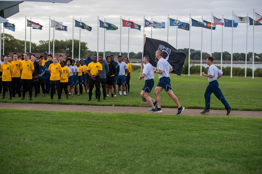 Members of the Air Force Sergeants Association start the 24-hour run with the POW/MIA flag at Joint Base Langley-Eustis, Virginia, Sept. 19, 2019. JBLE held the POW/MIA remembrance event that culminated a 24-hour run with the POW/MIA flag. (U.S. Air Force photo by Senior Airman Anthony Nin Leclerec)