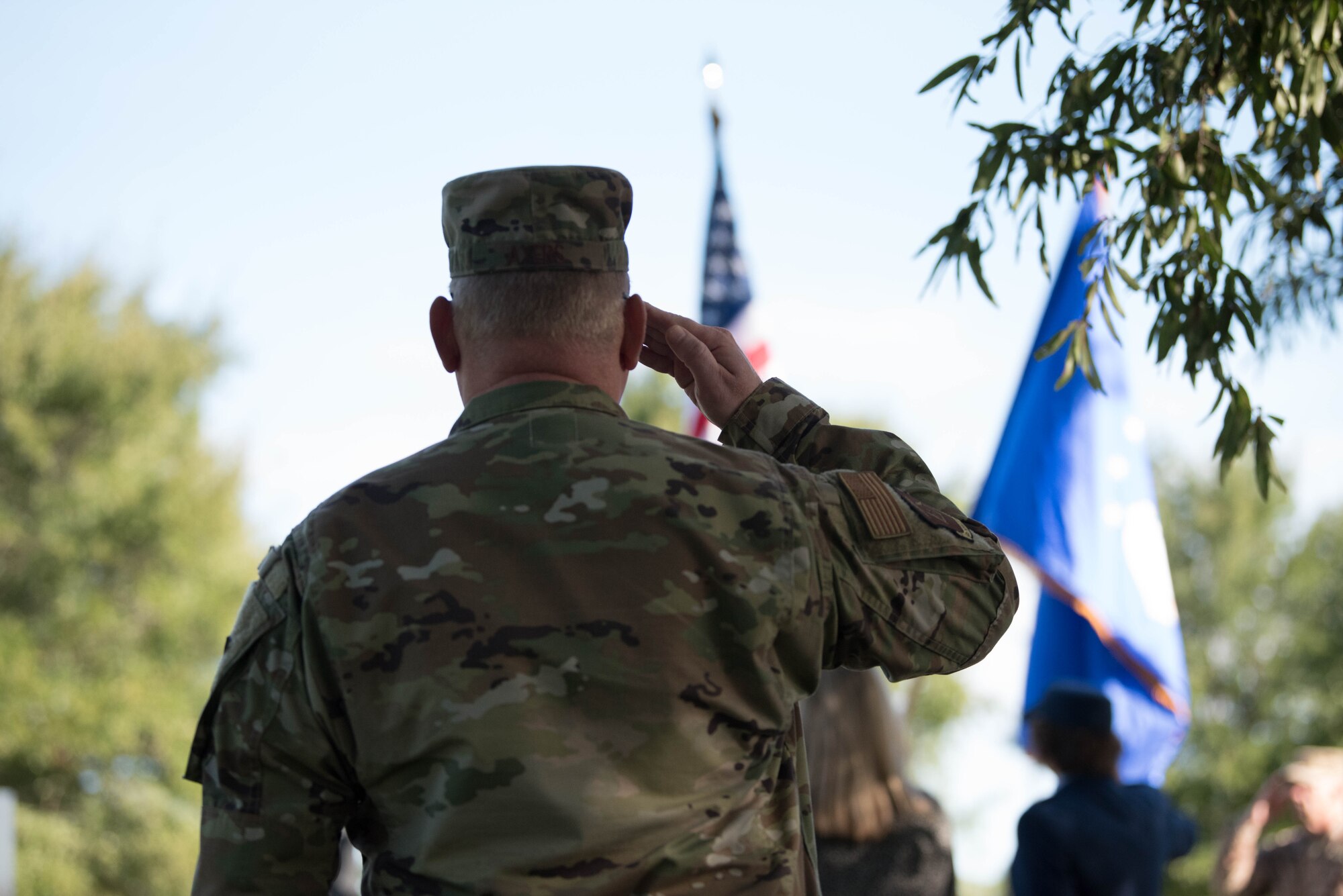 A U.S. Air Force Capt. Ryan Ayers 633rd Mission Support Group chaplain, salutes the flag during the playing of the National Anthem at the closing ceremony of the POW/MIA event at Joint Base Langley-Eustis, Sept. 20, 2019. Service members came to pay their respects over the course of the two day event on JBLE. (U.S. Air Force photo by Airman 1st Class Marcus M. Bullock)