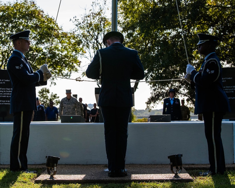 U.S. Air Force Airmen with the Langley Air Force Base Honor Guard raise the POW/MIA flag at Joint Base Langley-Eustis, Virginia, Sept. 20, 2019.  On the second day of the event, the POW/MIA flag was raised at the POW/MIA memorial on base. (U.S. Air Force photo by Airman 1st Class Marcus M. Bullock)