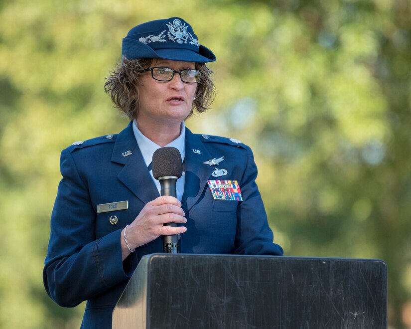 U.S. Air Force Lt. Col. Jennifer Ford, 633rd Mission Support Group deputy commander, gives a speech during the closing ceremony of the POW/MIA event at Joint Base Langley-Eustis, Virginia, Sept. 20, 2019. Ford noted there are still 82,000 warfighting Americans missing to this day. (U.S. Air Force photo by Airman 1st Class Marcus M. Bullock)