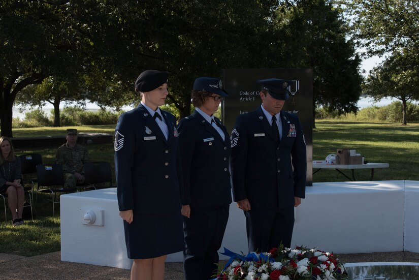 U.S. Air Force Airmen take a moment of silence after laying a wreath on the POW/MIA memorial during the POW/MIA event at Joint Base Langley-Eustis, Virginia, Sept. 20, 2019. During the event, service members were able to pay their respects to the 82,000 warfighting Americans still missing to this day. (U.S. Air Force photo by Airman 1st Class Marcus M. Bullock)