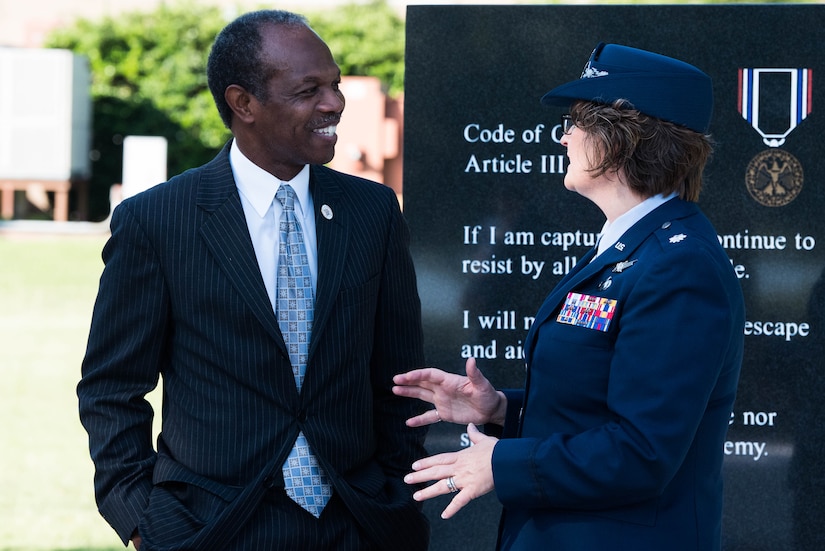 Donnie Tuck, Hampton City mayor, speaks with U.S. Air Force Lt. Col. Jennifer Ford, 633rd Mission Support Group deputy commander, during the POW/MIA closing ceremony at Joint Base Langley-Eustis, Virginia, Sept. 20, 2019. The event brought out community leaders and guest speakers to pay their respects to POW/MIA military members past and present. (U.S. Air Force photo by Airman 1st Class Marcus M. Bullock)