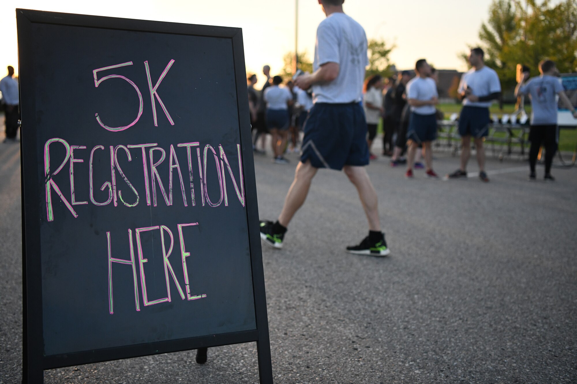 Airmen and family members from the 319th Reconnaissance Wing register for a Suicide Awareness 5K Sept. 20, 2019, on Grand Forks Air Force Base, North Dakota. The 5K was held to bring attention to those who struggle with or who have been lost to suicide. (U.S. Air Force photo by Airman 1st Class Brody Katka)