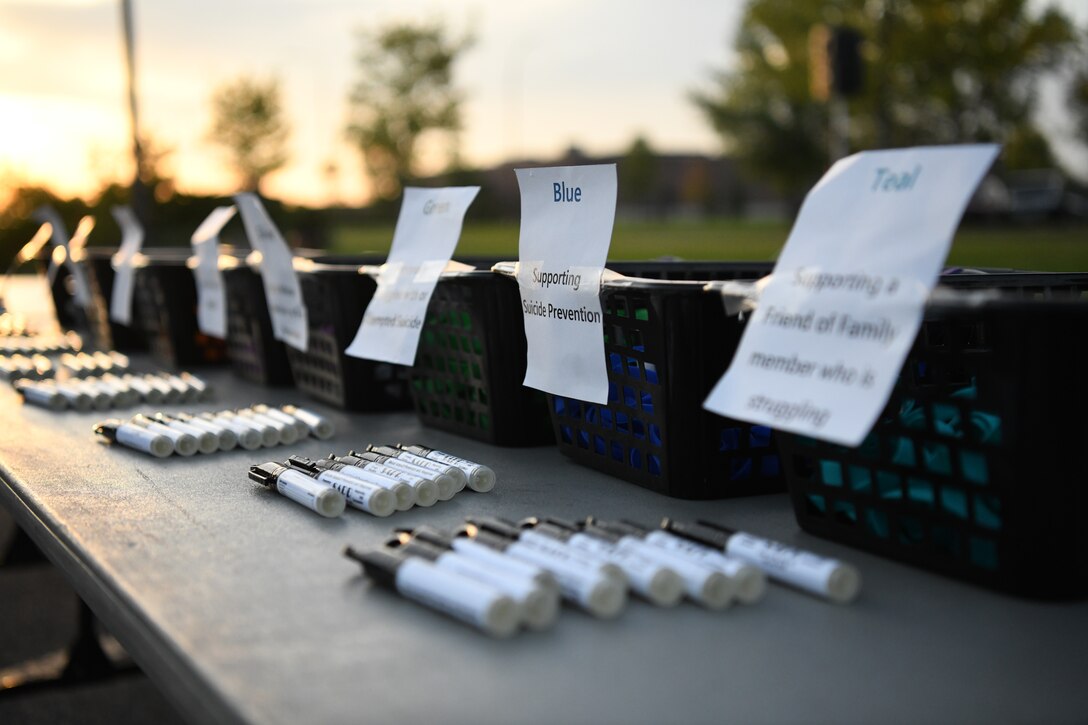 Colored wristbands are available at a registration table for participants to wear during a Suicide Awareness 5K Sept. 20, 2019, on Grand Forks Air Force Base, North Dakota. Participants wore the wristbands to symbolize the memory of someone they have lost or who has struggled with suicide. (U.S. Air Force photo by Airman 1st Class Brody Katka)
