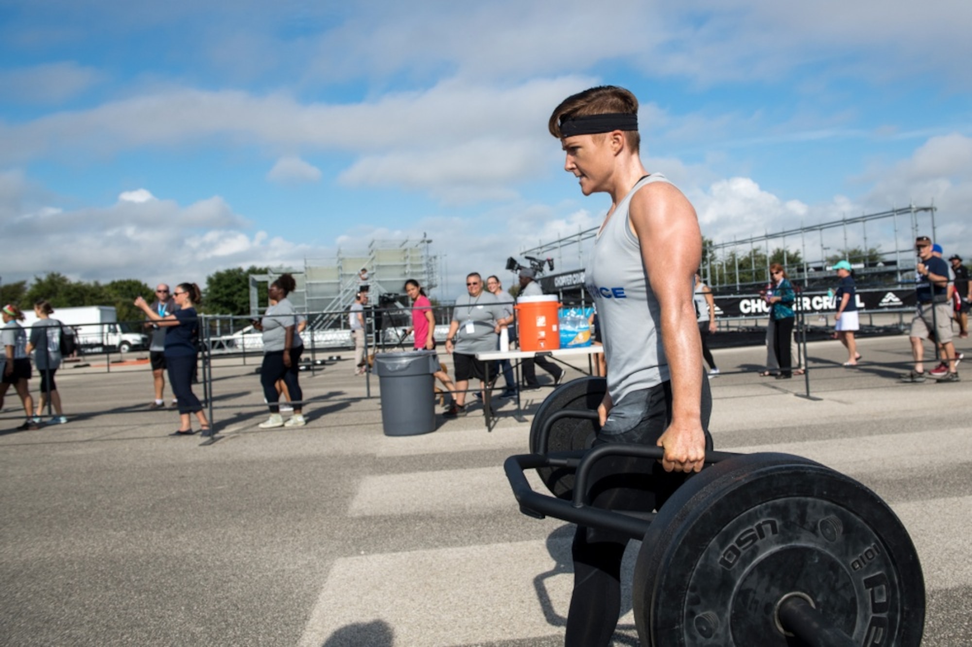 Second Lt. Michelle Strickland, 37th Flying Training Squadron student pilot, walks with weights for the farmer walk obstacle, Sept. 14, 2019, at Retama Park in Selma, Texas. Alpha warrior hosts battle competition where branches of the military can compete for fastest time. (Courtesy photo)