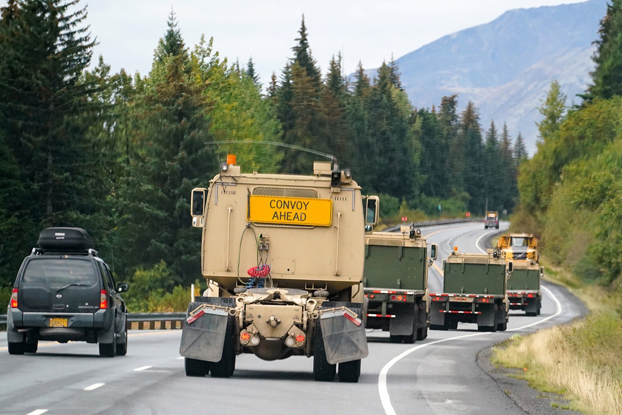 Soldiers assigned to the 109th Transportation Company, 17th Combat Support Sustainment Battalion, U.S. Army Alaska, convoy through the Kenai Penninsula to load U.S. Marine Corps bulk fuel supplies and equipment from the U.S.S. Comstock (LSD-45), a Whidbey Island-class dock landing ship, at the port of Seward, Alaska, Sept. 19, 2019, for transport to Joint Base Elmendorf-Richardson, Alaska. The U.S. Navy is conducting an Arctic Expeditionary Capabilities Exercise to test its logistical effectiveness and joint-service interoperability while responding to conflict or disaster in an austere environment with no organic assets.