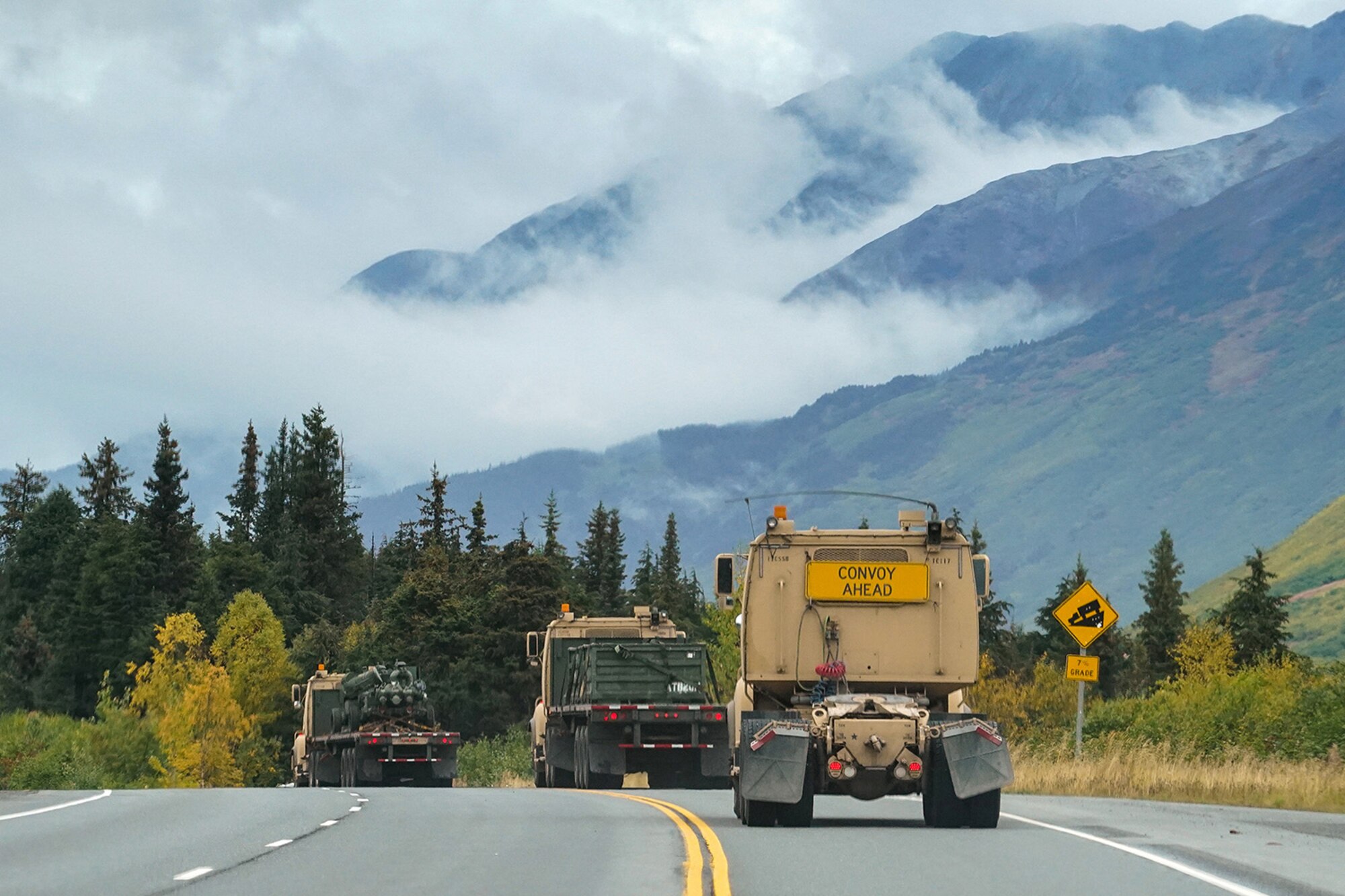 Soldiers assigned to the 109th Transportation Company, 17th Combat Support Sustainment Battalion, U.S. Army Alaska, convoy through the Kenai Penninsula after loading U.S. Marine Corps bulk fuel supplies and equipment from the U.S.S. Comstock (LSD-45), a Whidbey Island-class dock landing ship, at the port of Seward, Alaska, Sept. 19, 2019, for transport to Joint Base Elmendorf-Richardson, Alaska. The U.S. Navy is conducting an Arctic Expeditionary Capabilities Exercise to test its logistical effectiveness and joint-service interoperability while responding to conflict or disaster in an austere environment with no organic assets.