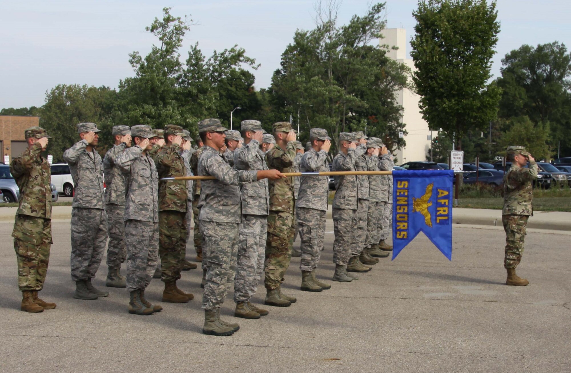 Military members of the Sensors Directorate, Air Force Research Laboratory, Wright-Patterson Air Force Base, and other personnel conduct a ceremony of remembrance and roll call on Sept. 11 of the names of people lost and known by personnel in the 9/11 attacks and in the War on Terror since that day. Col. Tracy Hunter is the new deputy director of the Sensors Directorate. (U.S. Air Force photo/Ted Pitts)