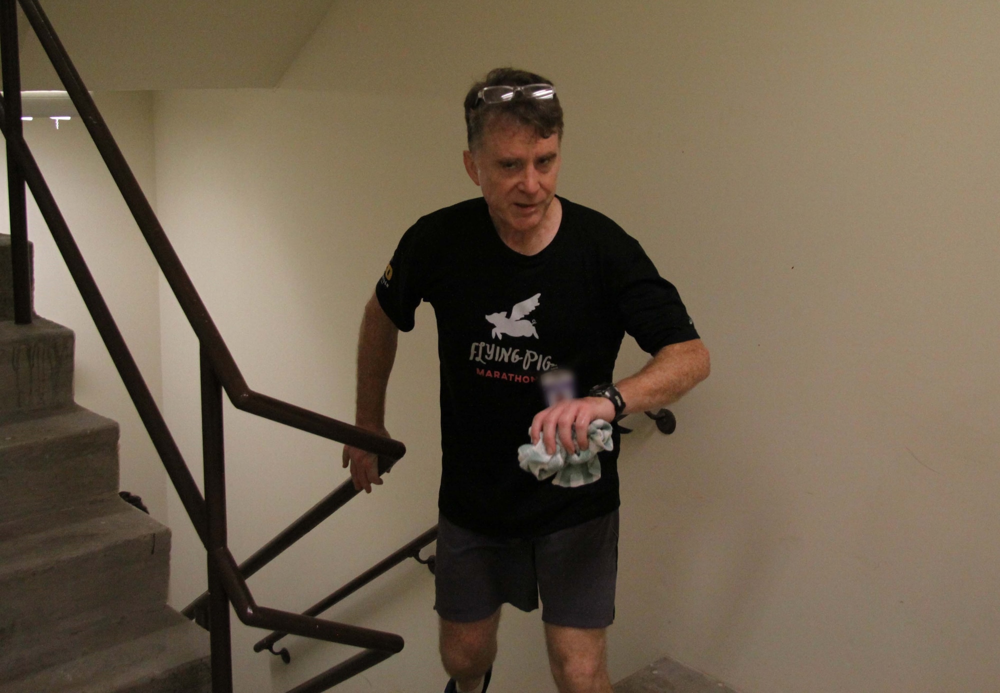 John ‘Jack’ Ebel, a technical advisor in the Radio Frequency Devices Branch, Sensors Directorate, Air Force Research Laboratory, Wright-Patterson Air Force Base, participates in the Tower Climb Sept. 12 in honor of those who lost their lives in the 9/11 attacks and since then during the War on Terror. Badge blurred for security purposes. (U.S. Air Force photo/Ryan Gilbert)