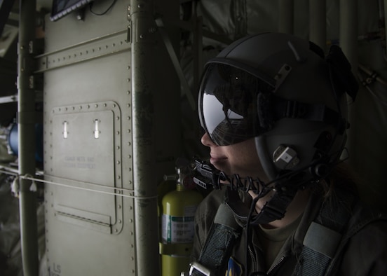 U.S. Air Force Staff Sgt. Stacy Robinson, a C-130J Super Hercules loadmaster assigned to the 37th Airlift Squadron, looks on as a jumpmaster inspects weather conditions prior to a jump over Plovdiv, Bulgaria, Sept. 24, 2019. Thracian Fall is a flying training deployment meant to increase interoperability between the U.S. Air Force and the Bulgarian air force. (U.S. Air Force photo by Staff Sgt. Kirsten Brandes