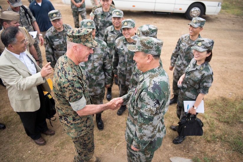 American general meets Chinese general and soldiers.