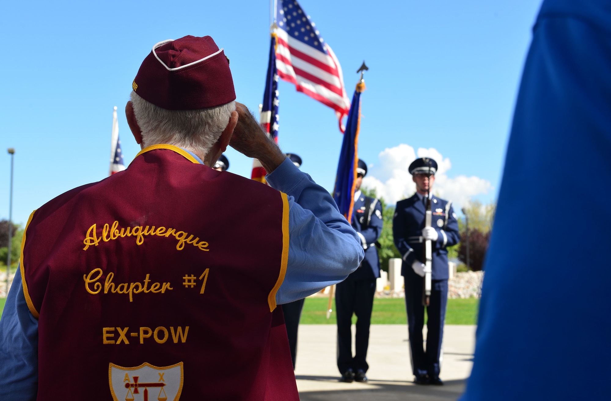 A former prisoner of war salutes during the national anthem at the POW/MIA ceremony in Albuquerque, N.M., Sept. 20, 2019. The ceremony was held at the New Mexico Veterans Memorial Park. (U.S. Air Force photo by Senior Airman Enrique Barceló)