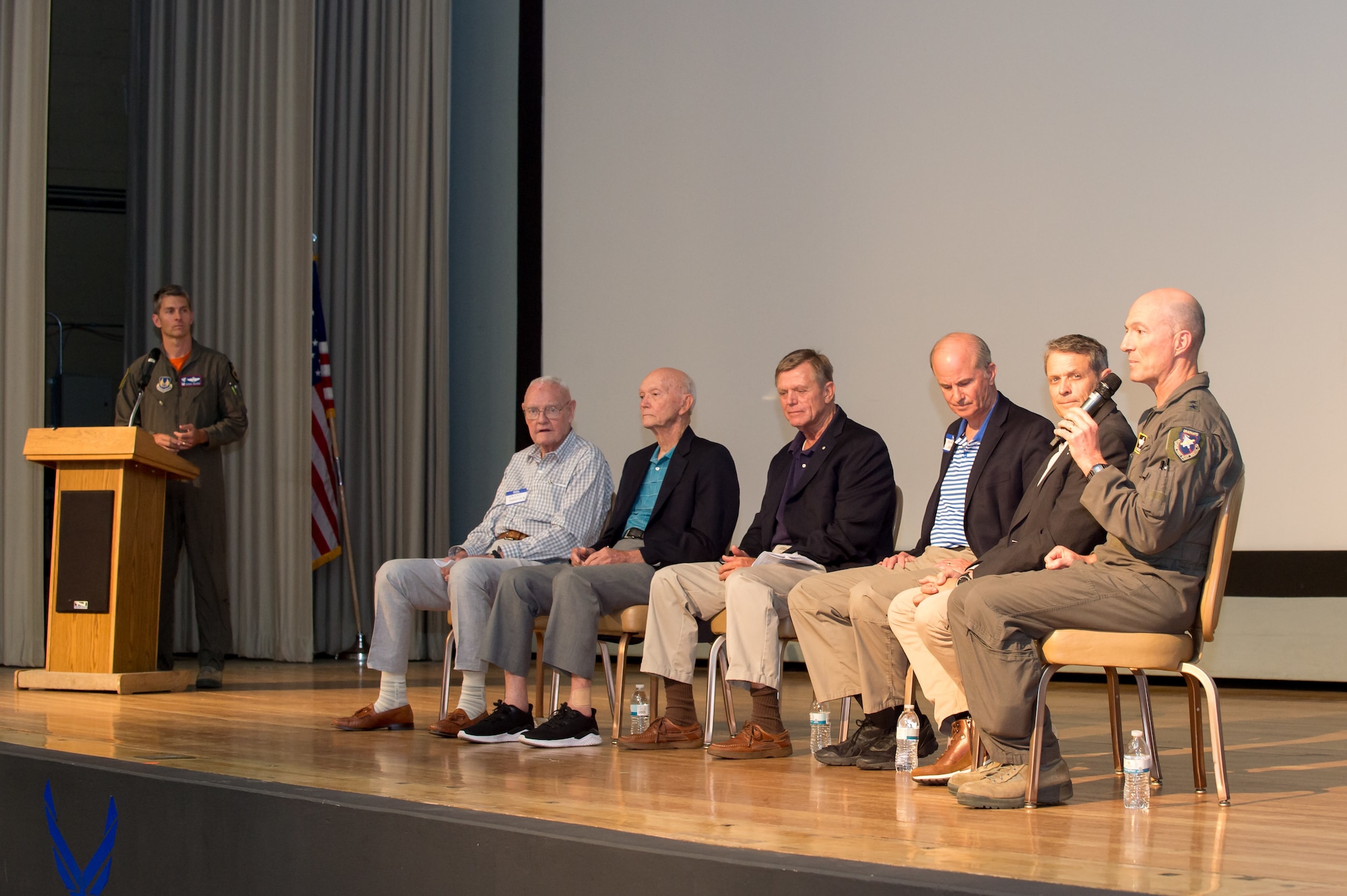 A group of U.S. Air Force test pilot school alumni, including Air Force Test Center Commander, Maj. Gen. Christoper Azzano (far right), respond to questions from base personnel as part of the school’s 75th anniversary celebration at Edwards Air Force Base, California, Sept. 20. (U.S. Air Force photo by Richard Gonzales)