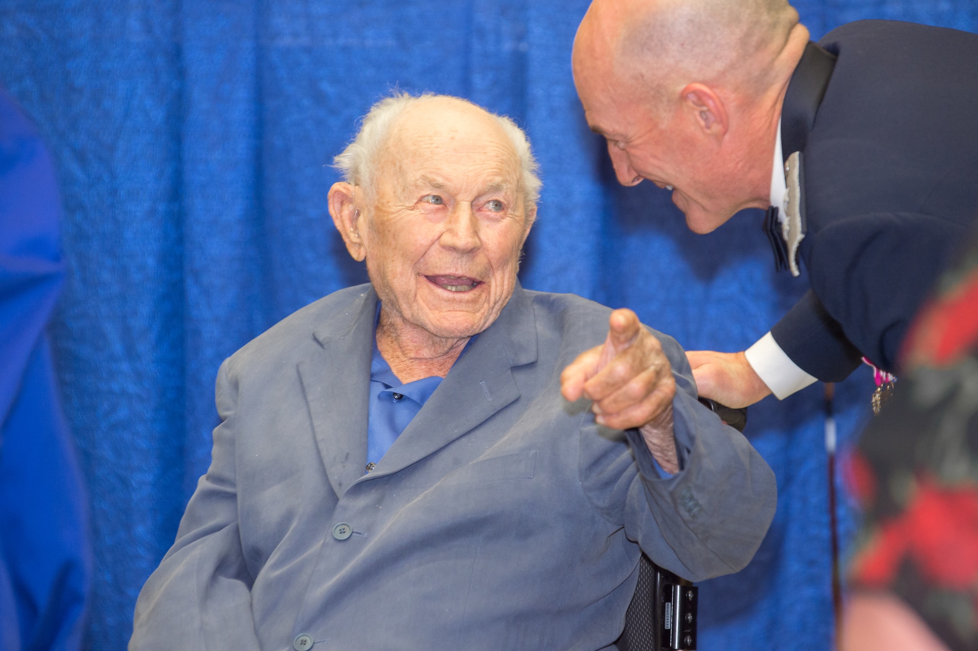 Brig. Gen. (Ret.) Chuck Yeager shares a conversation with Maj. Gen. Christopher Azzano, Air Force Test Center Commander, during U.S. Air Force Test Pilot School 75th anniversary celebration at Edwards Air Force Base, California, Sept. 21. Yeager is credited with being the first person to break the sound barrier in 1947 aboard a Bell X-1. (U.S. Air Force photo by Richard Gonzales)