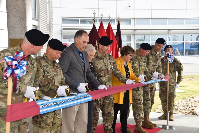 During a hospital dedication ceremony for the Brian D. Allgood Army Community Hospital U.S. Forces Korea senior leaders and Allgood  family members participate in a ribbon cutting,  Camp Humphreys, South Korea, Sep. 20. The hospital has been a major project for the Far East District and is now operational and accepting patients. The completed medical campus will be able to support 65,000 eligible beneficiaries and 5,000 annual inpatient admissions. (Photos by Antwaun J. Parrish)
